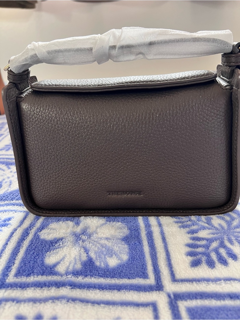 The Horse mini Clementine Compact Pebbled Leather Mini Bag in Dark Brown
